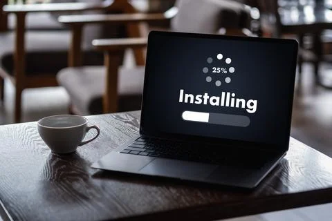 Man installing Software Update On Mobile Phone And Laptop digital technolog.. 写真素材