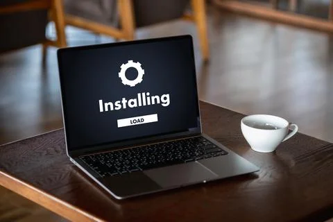 Man installing Software Update On Mobile Phone And Laptop digital technolog.. 写真素材