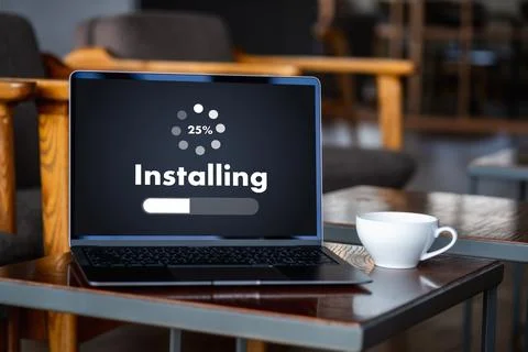 Man installing Software Update On Mobile Phone And Laptop digital technolog.. 写真素材