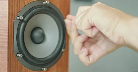 Man installing speakers into an audio system, emphasizing the concept of audio Video stock 279388566