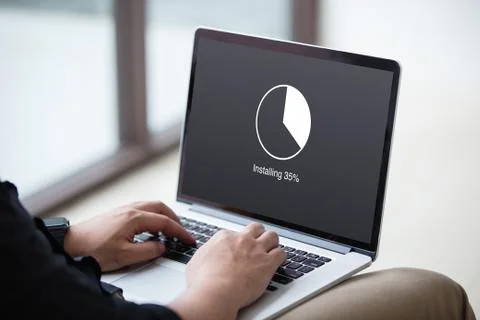 Man Installing update with circle load percentage waiting indicator concept  Stock Photos