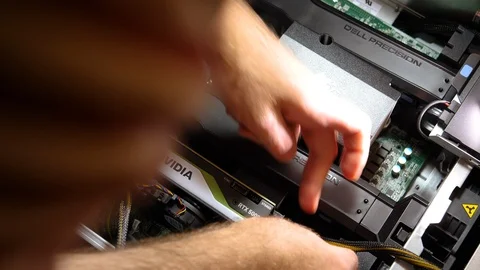 Man installing upgrade GPU card Quadro RTX 5000 workstation computer Stock Footage 103339158