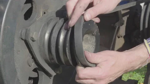 The man installs the belt on the engine Stock Footage 229839757
