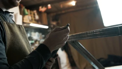 A man installs a nozzle in a screwdriver Stock Footage 142249796