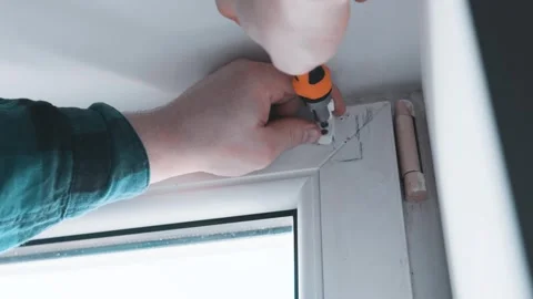 Man installs roller blinds. Handyman mesures window to fix it. Video stock 305342873