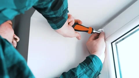 Man installs roller blinds. Handyman mesures window  Video stock 305342959