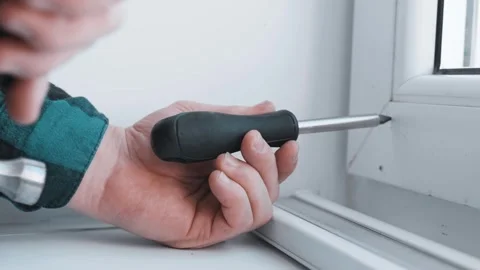 Man installs roller blinds. Handyman mesures window to fix it. Video stock 305343330