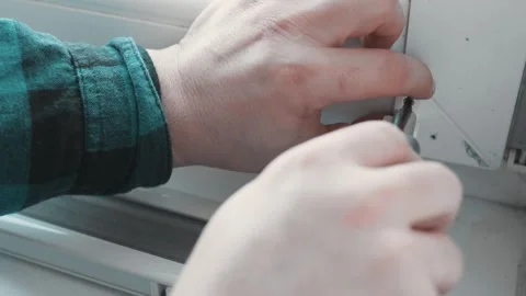 Man installs roller blinds. Handyman mesures window to fix it. Video stock 305343380