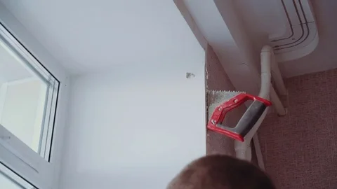 The man installs the windows Stock Footage 81500845