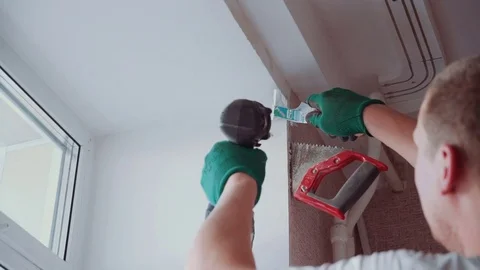 The man installs the windows Stock Footage 81500852