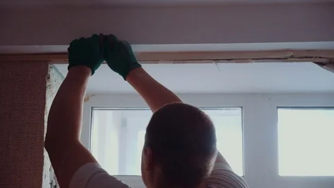 The man installs the windows Stock Footage 81501182