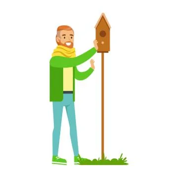 Man Instralling Bird House , Contributing Into Environment Preservation By Using Ilustración de archivo