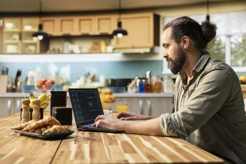 Man interacting with AI chatbot and virtual assistant at home 스톡 사진