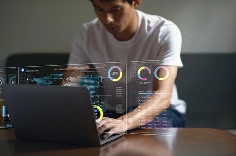 Man Interacting with Hologram Data Visualization on Laptop Screen Stockfoto's