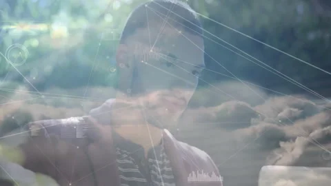 Man interacting with tech data outdoors, showing floating network lines, graphs Stock Footage 307434000