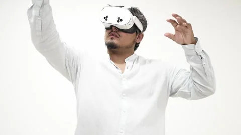 Man interacting with virtual reality headset Stock Footage 309772318