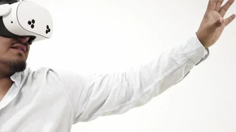Man interacting with virtual reality headset 스톡 동영상 309772324