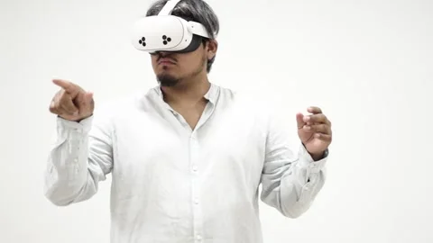 Man interacting with virtual reality headset Stock Footage 309772353
