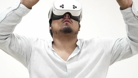 Man interacting with virtual reality headset Stock Footage 309772419