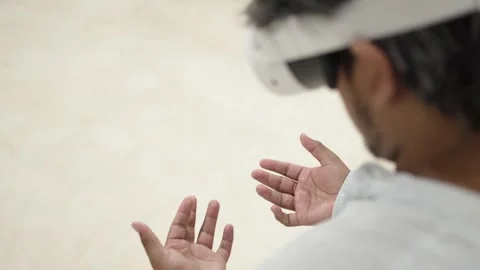 Man interacting with virtual reality headset Stock Footage 309772665