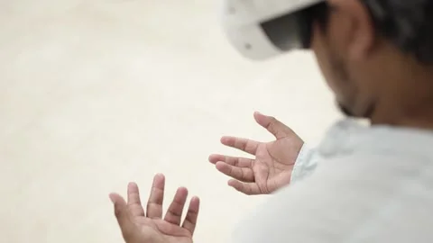 Man interacting with virtual reality headset Stock Footage 309772673