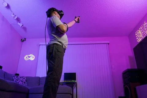 Man interacting with virtual world in full body view Stock Photos