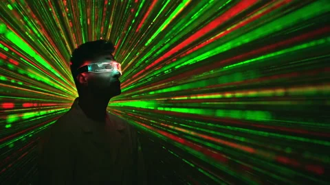 The man in the interactive glasses on the laser beam background Stock Footage 191501923