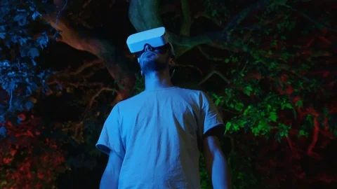 Man interacts with virtual reality interface using VR headset gadget Stock Footage 107132730