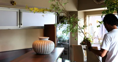 Man interier designer with flowers Stock Footage 161960035