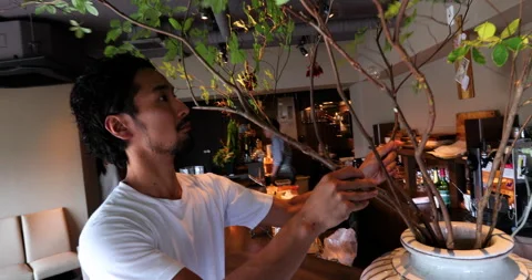 Man interier designer with flowers Video stock 161960601