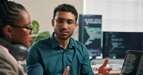 Man, intern and training at web development startup, tech screen and explaining Stock Footage 346950399