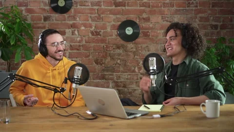 Man interviewing guest in a studio for music podcast Spbd. Happy host smile Stock Footage 154923337