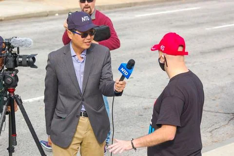 Man interviewing protestor Stock Photos