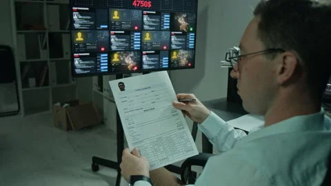 Man Investigating Financial Crime Data in Cybersecurity Office Stock Footage 346709748