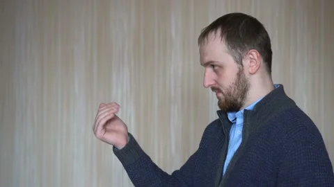 Man inviting to come, confident and smiling making a gesture with hand, being Stock Footage 103120388
