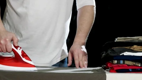 Man Ironing Clothes Stock Footage 84881843