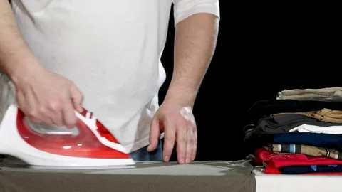 Man Ironing Clothes Stock Footage 85399546