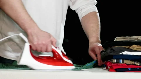 Man Ironing Clothes Stock Footage 86292225