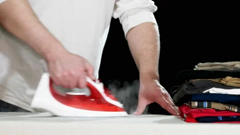 Man Ironing Clothes Stock Footage 86293183