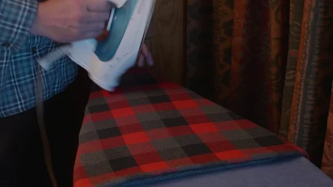 Man Ironing a Flannel Stock Footage 86202647