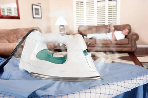 Man ironing Stock Photos