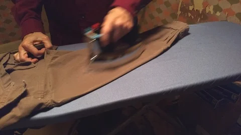 Man Irons Shirt Stock Footage 101966253