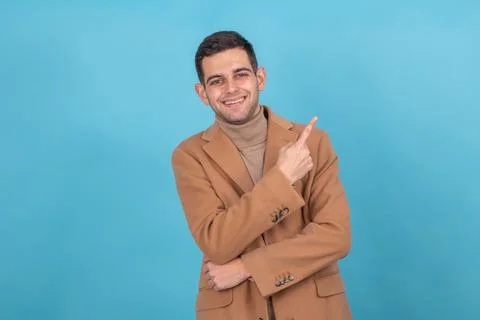 Man with isolated coat pointing Stock Photos