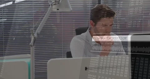 Man at IT desk reacting as cybersecurity overlay appearing, pondering then Stock Footage 331109423