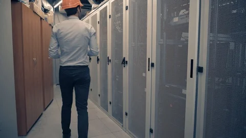 Man IT Engineer In Helmet Working In Server Room.Technical Engineer Working. 库存影片 104199350
