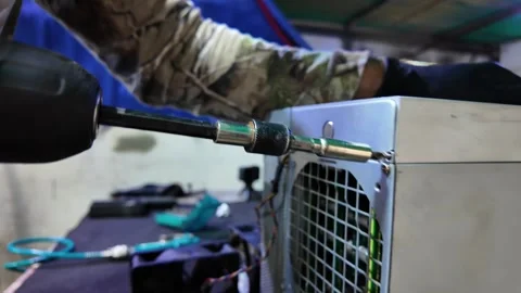 Man it support assembling cryptocurrency mining rig using a cordless drill Stock Footage 332109173