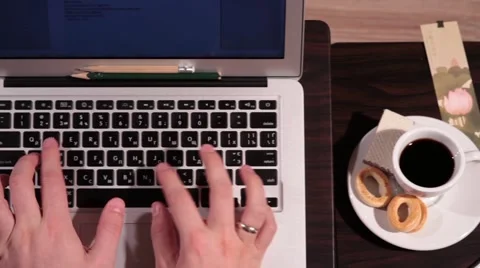 A man it working on computer - panning view Stock Footage 58395474