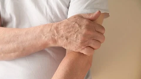 Man with itchy upper arm Stock Footage 11292536