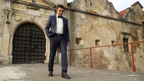 A man in a jacket in the castle Stock Footage 98453404