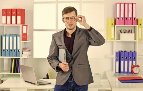 Man in jacket folder successful manager work with documents, according to plan 库存照片